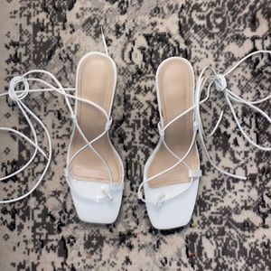 Lace up white heels